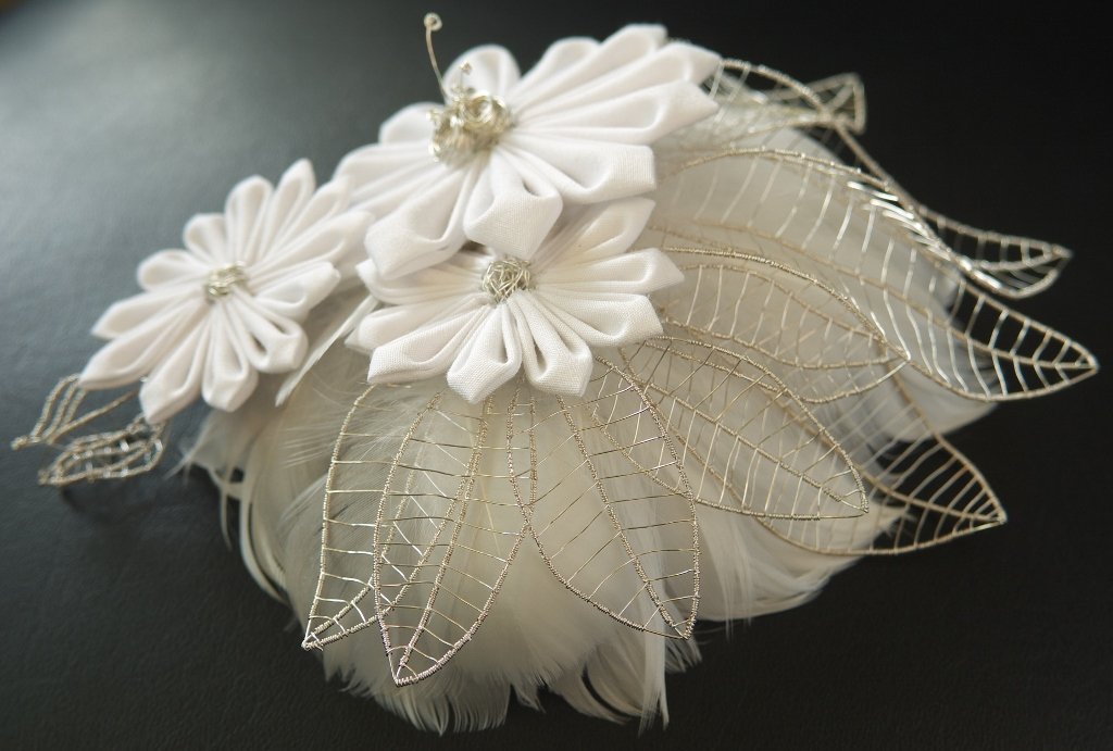 Handmade bridal hair ornaments consisting of cotton flowers, silver wire and feathers