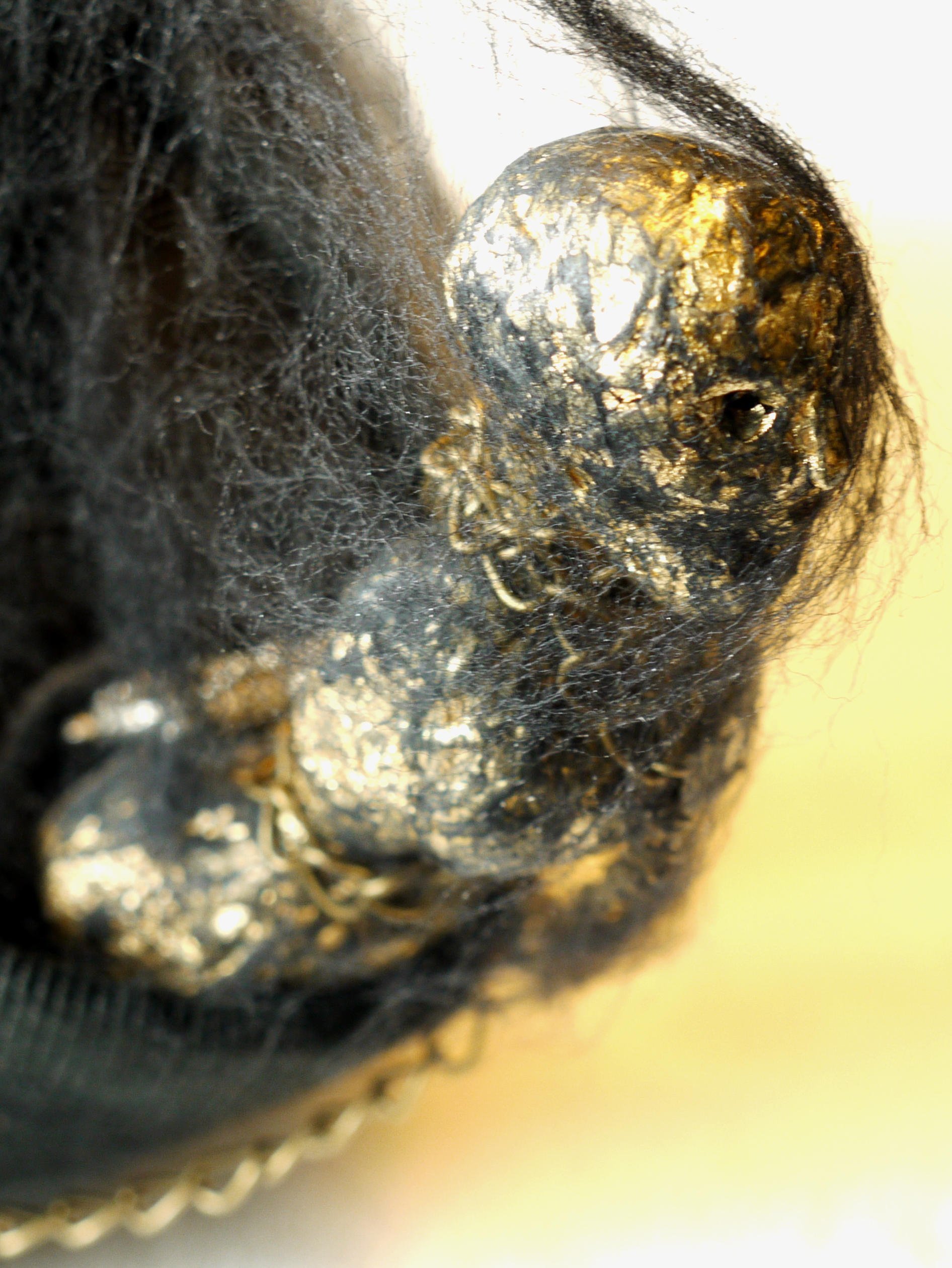 Hand-carved figurehead with gold leaf decoration